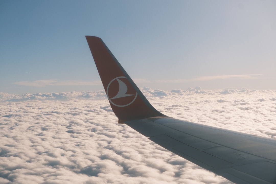 Turkish Airlines plane flying at sunset